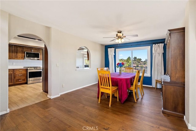 dining room with ceiling fan and hardwood / wood-style floors