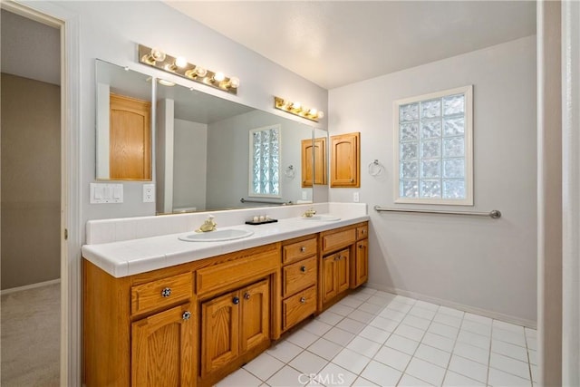 bathroom with tile patterned floors and vanity