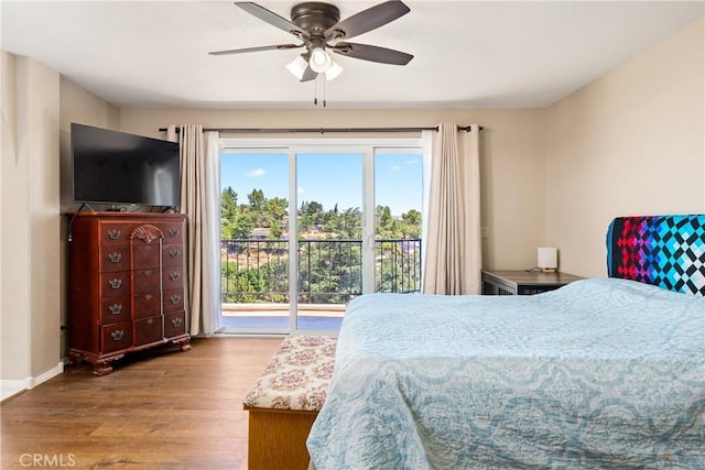 bedroom with ceiling fan, wood-type flooring, and access to exterior