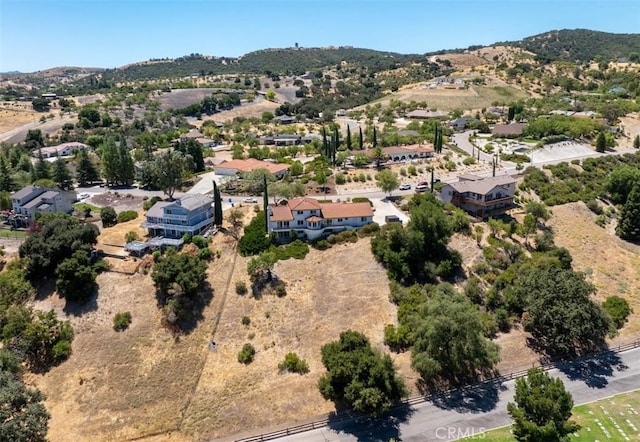 birds eye view of property with a mountain view