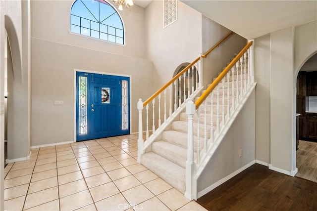 foyer entrance featuring a notable chandelier and light hardwood / wood-style floors