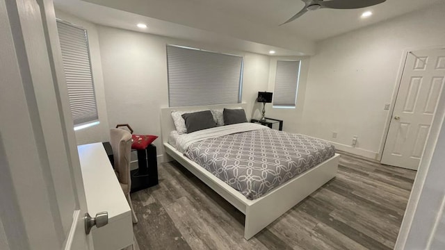 bedroom featuring dark hardwood / wood-style floors and ceiling fan