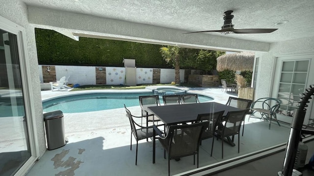 view of swimming pool with a patio area and ceiling fan