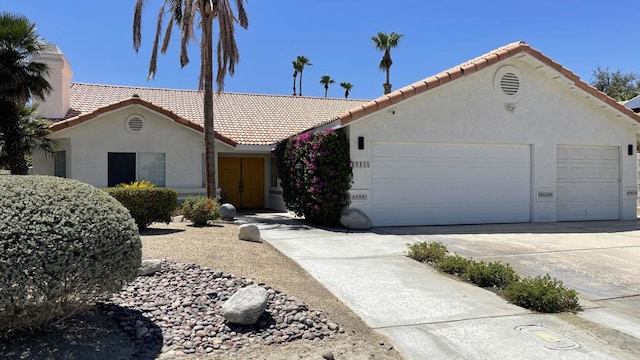 single story home with a garage