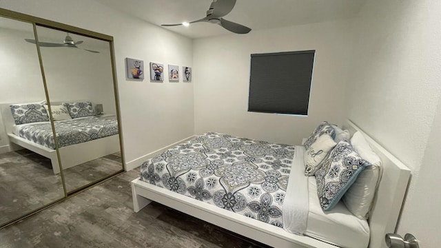 bedroom with a closet, ceiling fan, and wood-type flooring