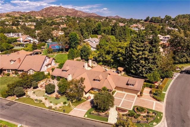 birds eye view of property featuring a mountain view