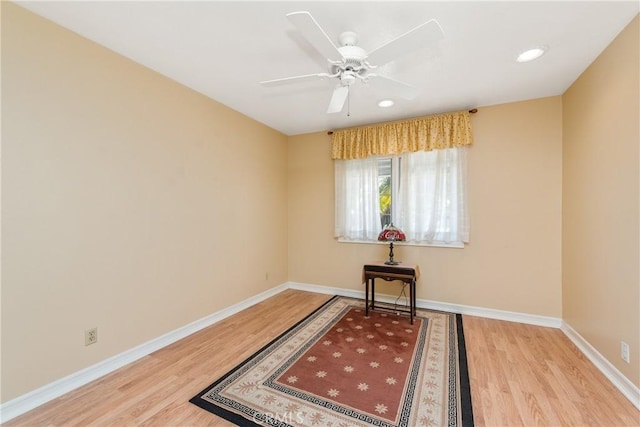 interior space with ceiling fan and light hardwood / wood-style floors