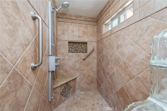 bathroom featuring tiled shower