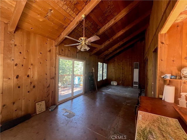 empty room with beam ceiling, ceiling fan, wooden ceiling, and wood walls