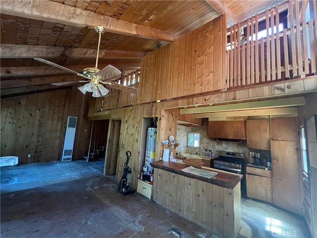 kitchen featuring gas water heater, high vaulted ceiling, stainless steel electric range oven, and ceiling fan