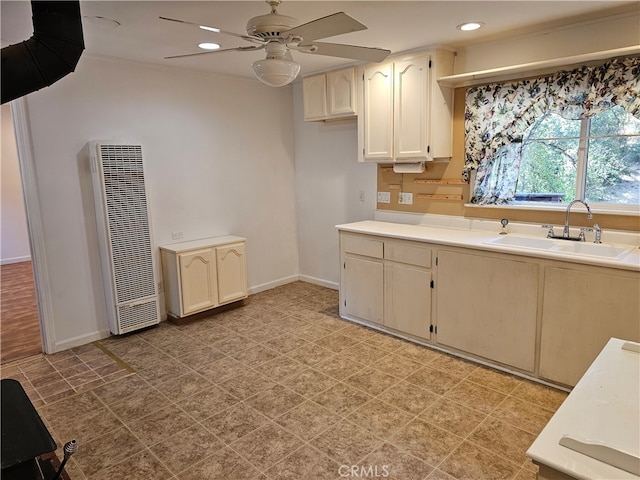 kitchen featuring sink and ceiling fan