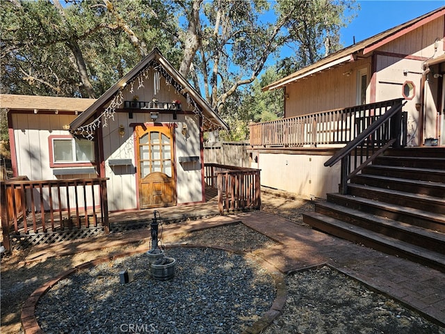 view of side of property featuring a deck