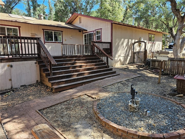 back of property with a patio