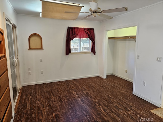 unfurnished bedroom featuring a closet, ceiling fan, crown molding, and dark hardwood / wood-style flooring