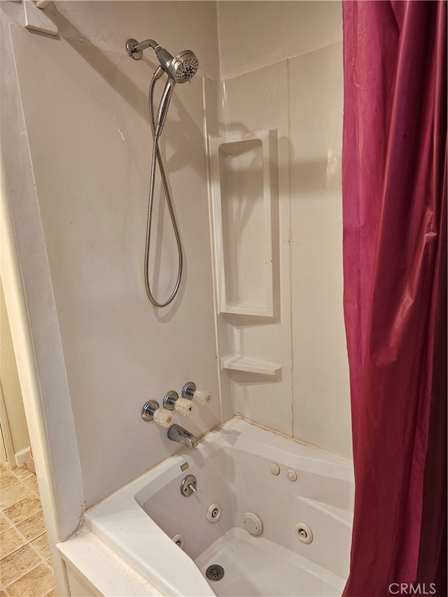 bathroom featuring shower / bath combo and tile patterned flooring