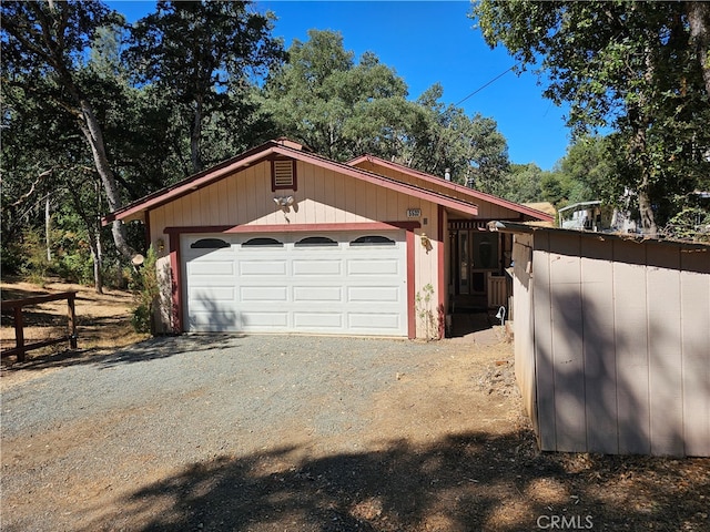 garage featuring wood walls