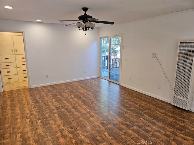 empty room with dark wood-type flooring and ceiling fan