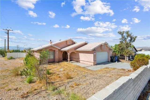 single story home with a garage