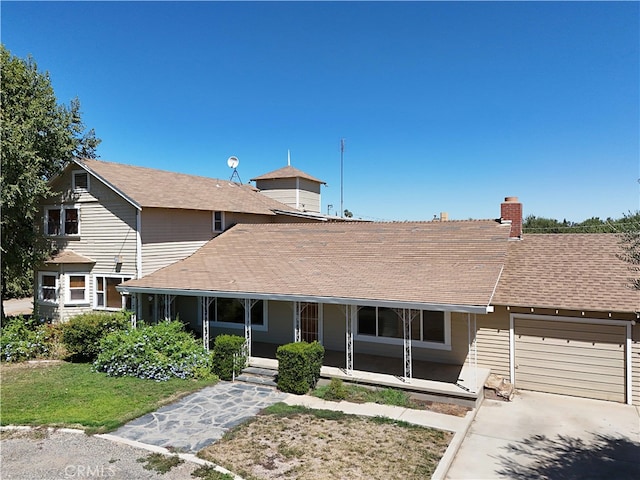 view of front of home with a garage and covered porch