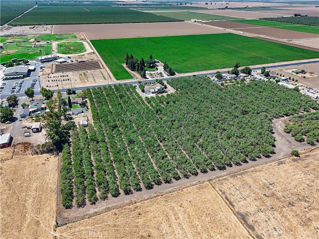 birds eye view of property with a rural view