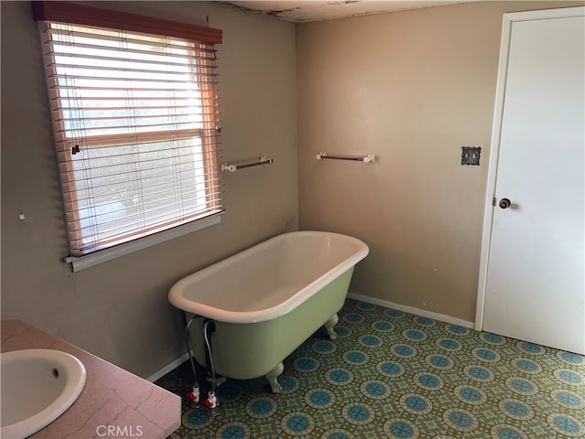 bathroom with sink and a washtub