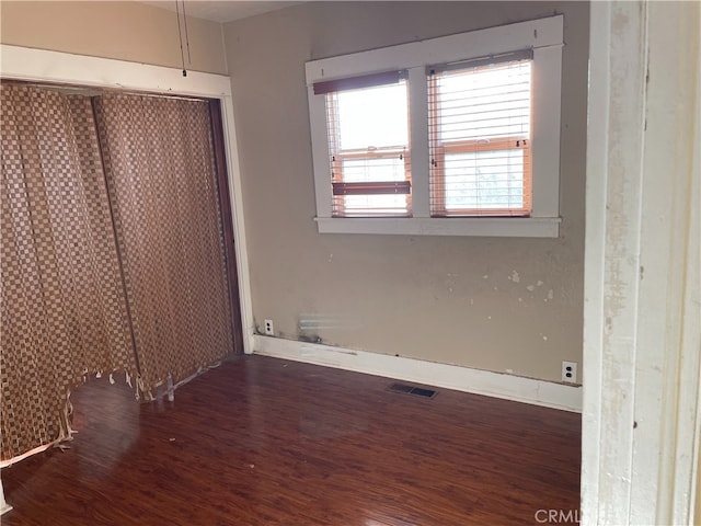 unfurnished bedroom with hardwood / wood-style floors