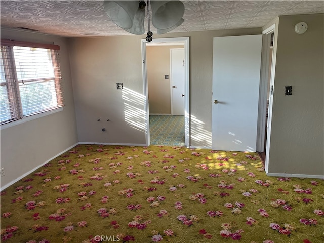 spare room featuring carpet floors