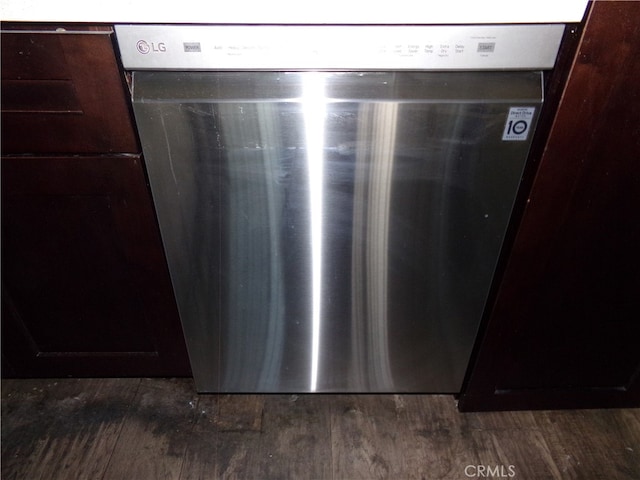 room details featuring dark brown cabinets, dishwasher, and dark hardwood / wood-style floors