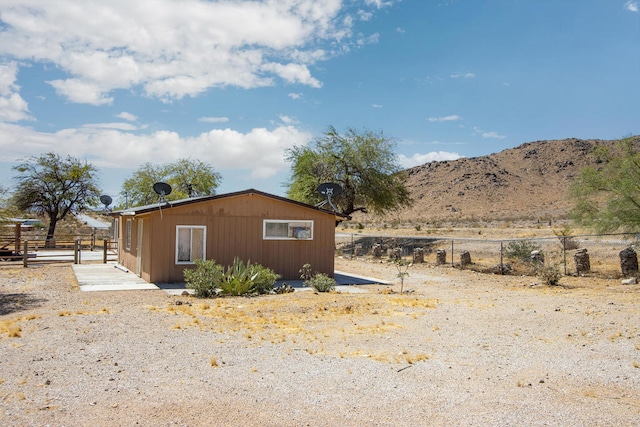 view of side of home with a mountain view