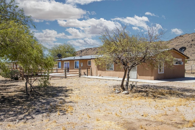 view of front of home featuring a mountain view