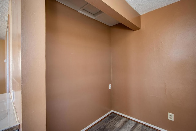 interior space featuring hardwood / wood-style floors and a textured ceiling