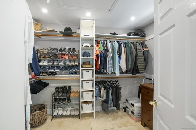 walk in closet featuring light tile patterned floors