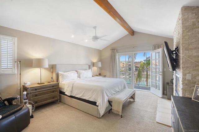 carpeted bedroom featuring access to outside, a fireplace, lofted ceiling with beams, and ceiling fan