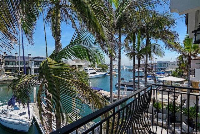 balcony featuring a water view