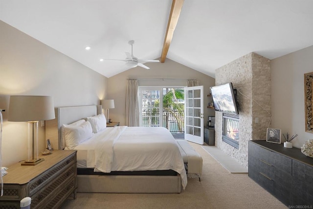 carpeted bedroom with lofted ceiling with beams, ceiling fan, access to exterior, and a fireplace