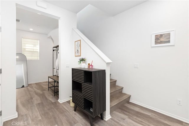 stairway with wood-type flooring