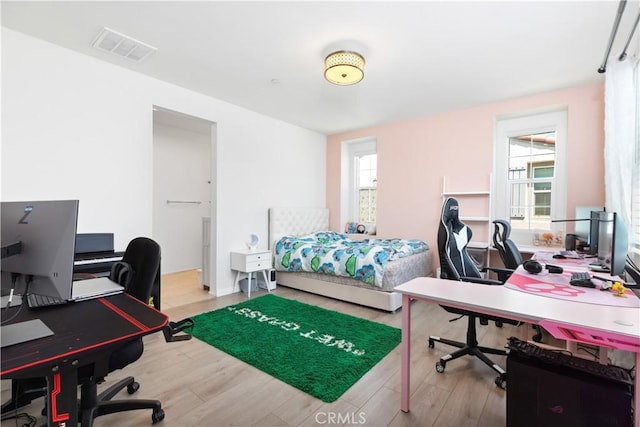 bedroom with light wood-type flooring