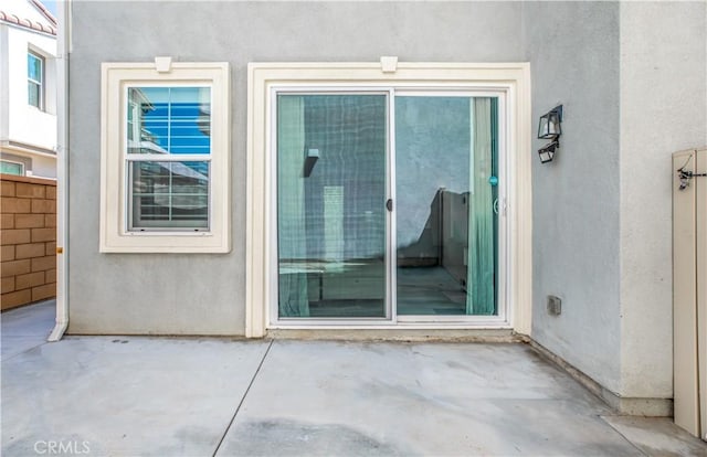 doorway to property featuring a patio