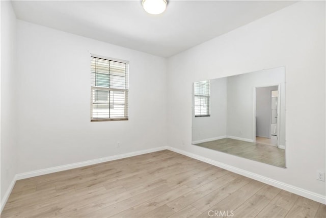 unfurnished room featuring light hardwood / wood-style flooring