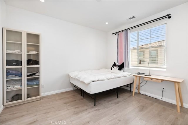 bedroom with light wood-type flooring