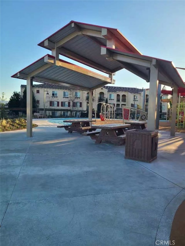 surrounding community with a patio area