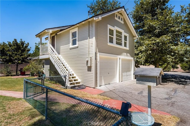 view of front of property with a front lawn and a garage