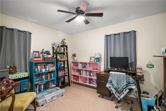 office area with light carpet and ceiling fan