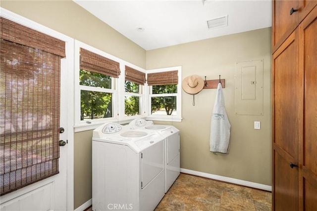 clothes washing area with washer and clothes dryer