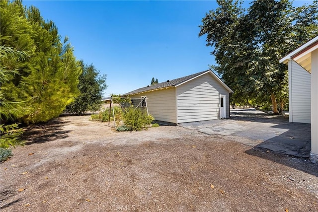 view of property exterior with a patio area