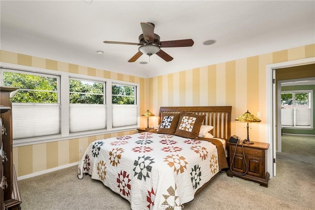 bedroom featuring ceiling fan and light colored carpet