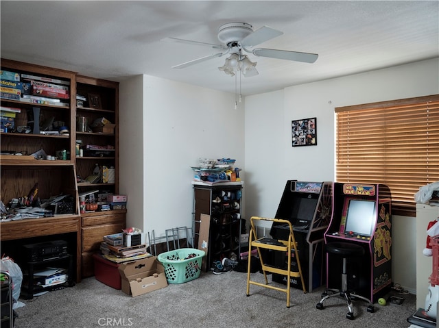 home office featuring carpet flooring and ceiling fan