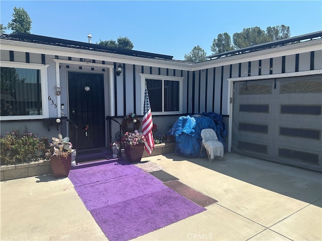 property entrance with a garage