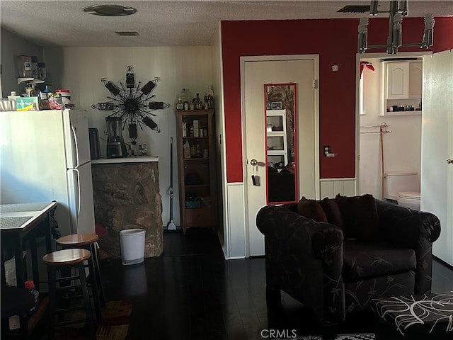 interior space featuring a textured ceiling