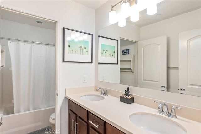 full bathroom featuring shower / tub combo, vanity, and toilet